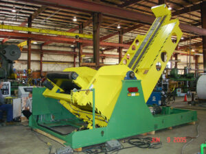 Large yellow and green industrial conveyor system in a workshop